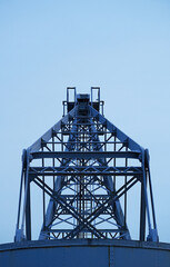 Symmetrical Modern Industrial freight crane at a Ship Harbor