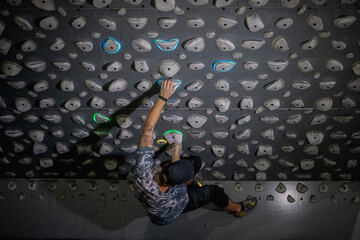 Kilter board climber © Christian