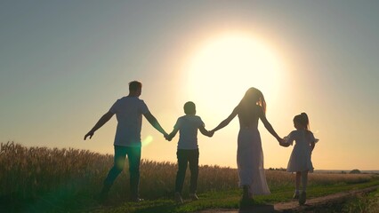 Cheerful mother father, little daughter play enjoy nature outdoors. Slow motion. Mom, dad and child...