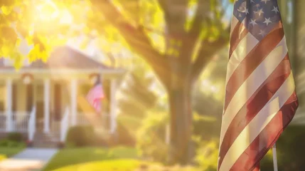 Tuinposter American flag displayed on house corner with blurred background © JovialFox