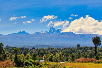 Beautiful view of Mount Kenya, highest mountain in Kenya at 5199 meters rising from the central highlands on a crisp and bright winter day as seen from Nanyuki area on the equator in Kenya - obrazy, fototapety, plakaty
