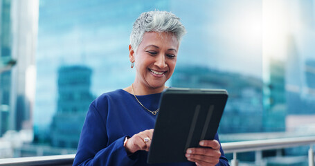 Fototapeta premium Tablet, thinking and happy senior business woman on a balcony laughing at social media, gift or chat. Digital, search and elderly female entrepreneur online on a rooftop with funny video or message