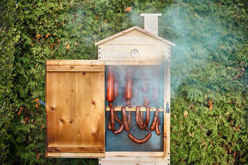 Homemade sausage and cheese in the smokehouse
