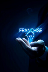 vertical image of Illuminated Lightbulb with FRANCHISE Text in Businessman's hand, Opportunity and partnership Concept