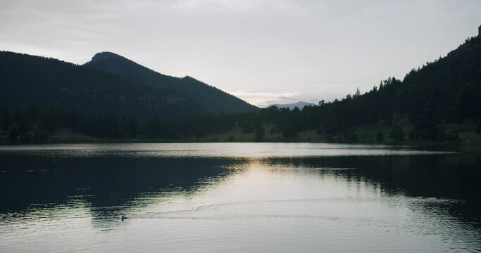 peaceful lake in colorado in mountains at sunset