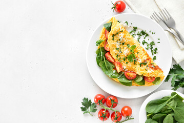 Stuffed omelette with tomatoes and spinach