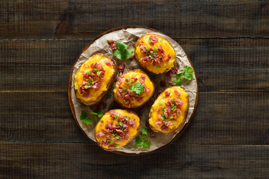 Baked stuffed potatoes with bacon, green onion and cheddar cheese