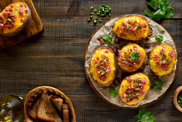 Baked stuffed potatoes with bacon, green onion and cheddar cheese