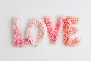 Word Love made from fur, fluffy font isolated on white background - 784719722