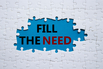 Fill the need symbol. Concept word Fill the need on white puzzle. Beautiful blue background....