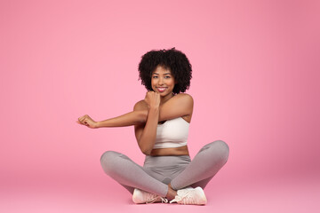 Smiling lady sitting with a yoga pose