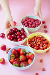 Strawberry,cherry,raspberry berries in bowls