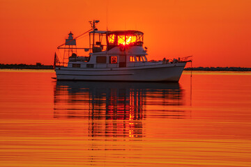Sunrise Boat at West Bay Harbor
