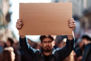 Protestors on the street holding blank cardboard banner sign. Global strike for change - 784738758