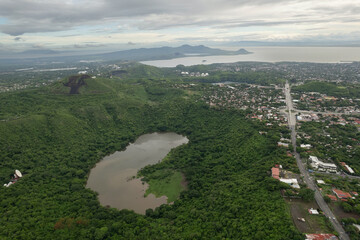Green volcano crater next to Managua city