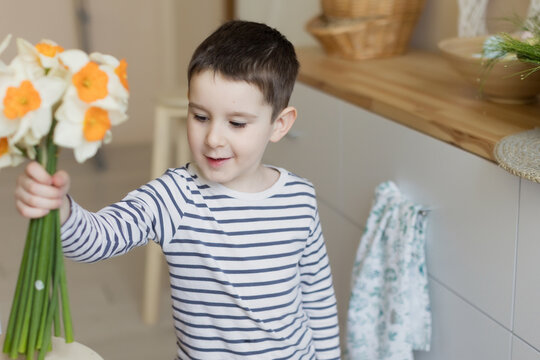 Child with daffodils and Easter decor