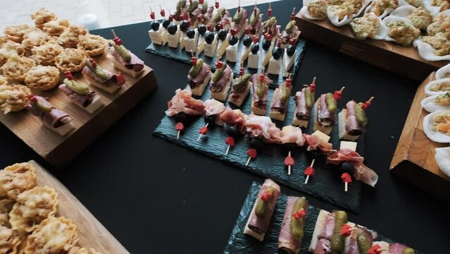 Variety of gourmet appetizers on a buffet table at a luxury event