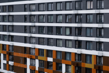 New apartment buildings with windows and balconies. Modern european complex of apartment buildings....