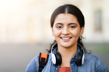 Smiling Indian lady student with outdoor background