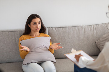 Woman explaining her issues during therapy session