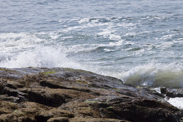 Ocean waves splashing on a rocky shore