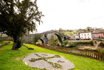 Roman bridge in the town of Cangas de Onis, Asturias, Spain - 784770352