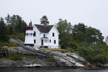 Lighthouse on a Maine River bank