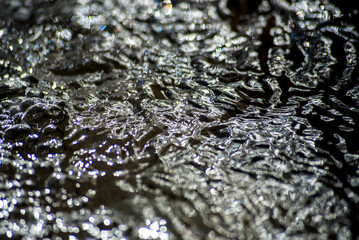 Surface of water in motion with transparencies and colors