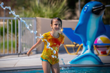 Close up portrait of very happy young girl under a water stream at water park. Summer water park and holiday concept. Horizontal image. - 784770972