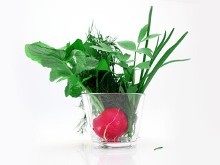 A portion of herbs and new vegetables as a healthy addition to a spring breakfast.  Radish, dill,...