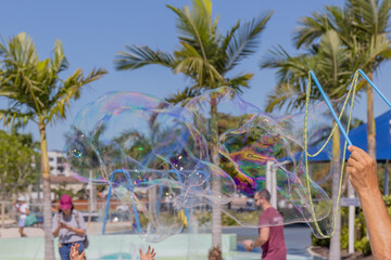 Bubbles blowing in the wind at the park.