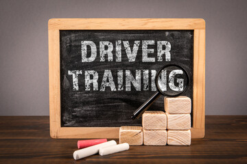 Driver Training. Chalkboard with text on wooden texture table - 784773708