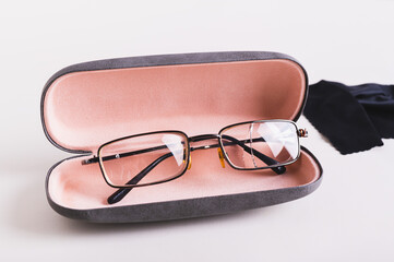 Concept of proper storage of glasses in a hard case on the table
