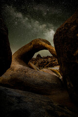 Galaxy milky way surrounded by stars with Mobius Arch on foreground	