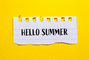 Hello summer words written on ripped paper with yellow background. Conceptual symbol. Copy space.