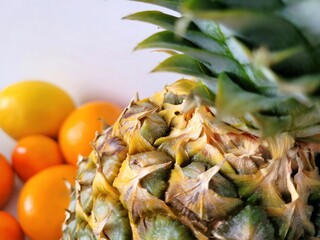 One pineapple and many citrus fruits.