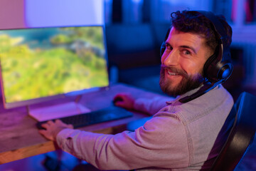 Gamer enjoying vivid game graphics in neon light