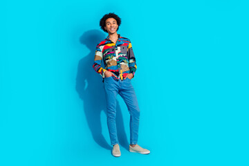 Fototapeta premium Full size photo of handsome young guy posing model shopping dressed stylish print garment isolated on blue color background