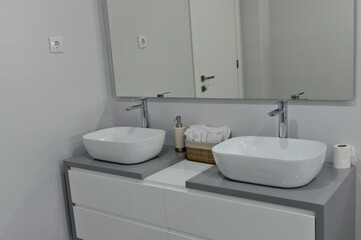 Fototapeta na wymiar close up: new design bathroom with two basins, washbasins,