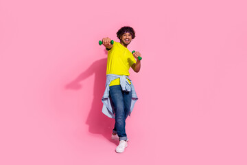 Photo of cheerful athletic man wear trendy yellow clothes exercising gym box ring isolated on pink...