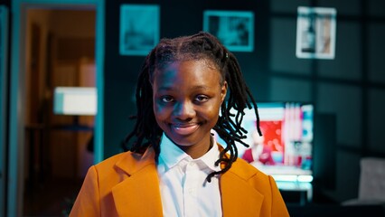 Portrait of university student participating in e learning courses, reviewing lesson materials and lecture notes at home office. Dedicated girl writing ideas for future exams or tests. Camera B.