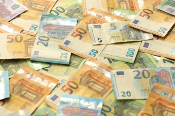 Obraz na płótnie Canvas Many european euro money bills. Lot of banknotes of european union currency close up
