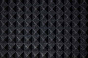 Background of sound absorbing sponge. Wall soundproofing. Pyramid style padding layer panel for...