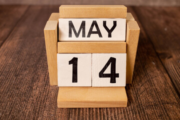 14 fourteenth day May Month Calendar Concept on Wooden Blocks. Close up.