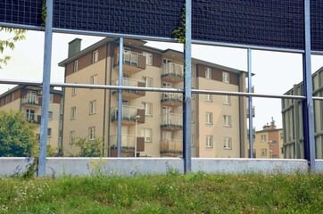 Panels against noise cars - view of new apartment blocks through panel windows