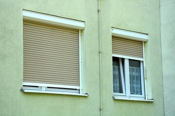 Residential building with roller shutters - obrazy, fototapety, plakaty