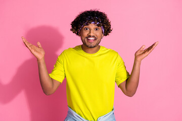 Photo of funny shocked cheerful man wear trendy yellow clothes isolated on pink color background