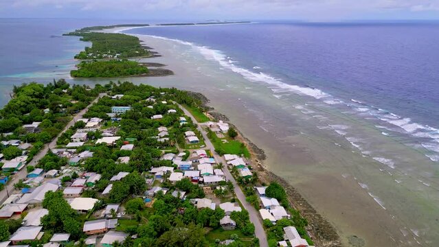 MARSHALL ISLANDS - 3.18.2024 - Excellent aerial footage moving along houses on the coast of Majuro in the Marshall Islands.