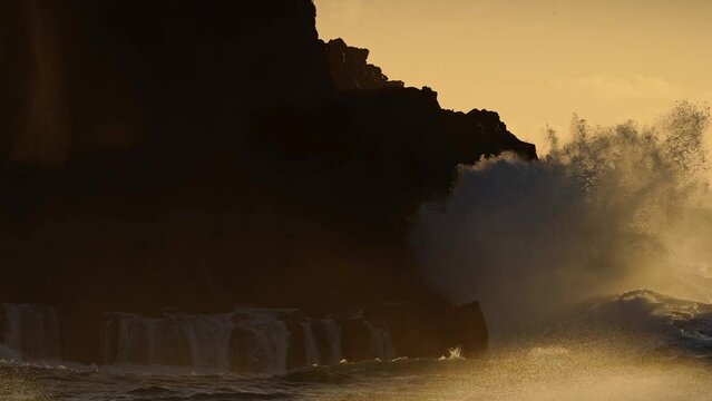 HAWAII - 3.18.2024 - Amazing slow motion footage of waves crashing upon Molokai, Hawaii at sunset.