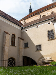 Heiligenkreuz, Austria - April 14, 2024: overall view on the details of exterior and interior of the Stift Heiligenkreuz abbey - 784835979